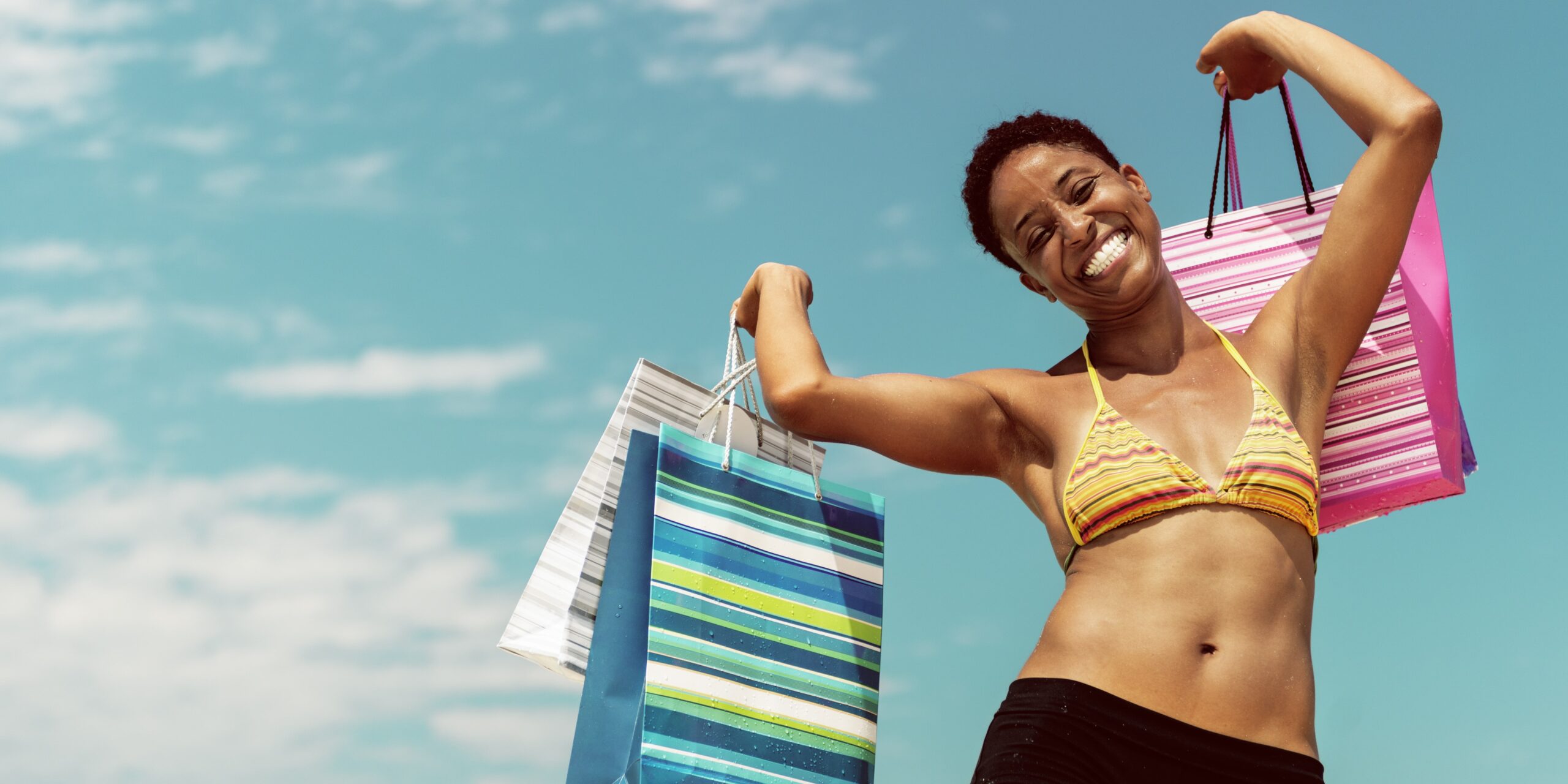 Picture of woman holding bags after a day of Dauphin Island shopping