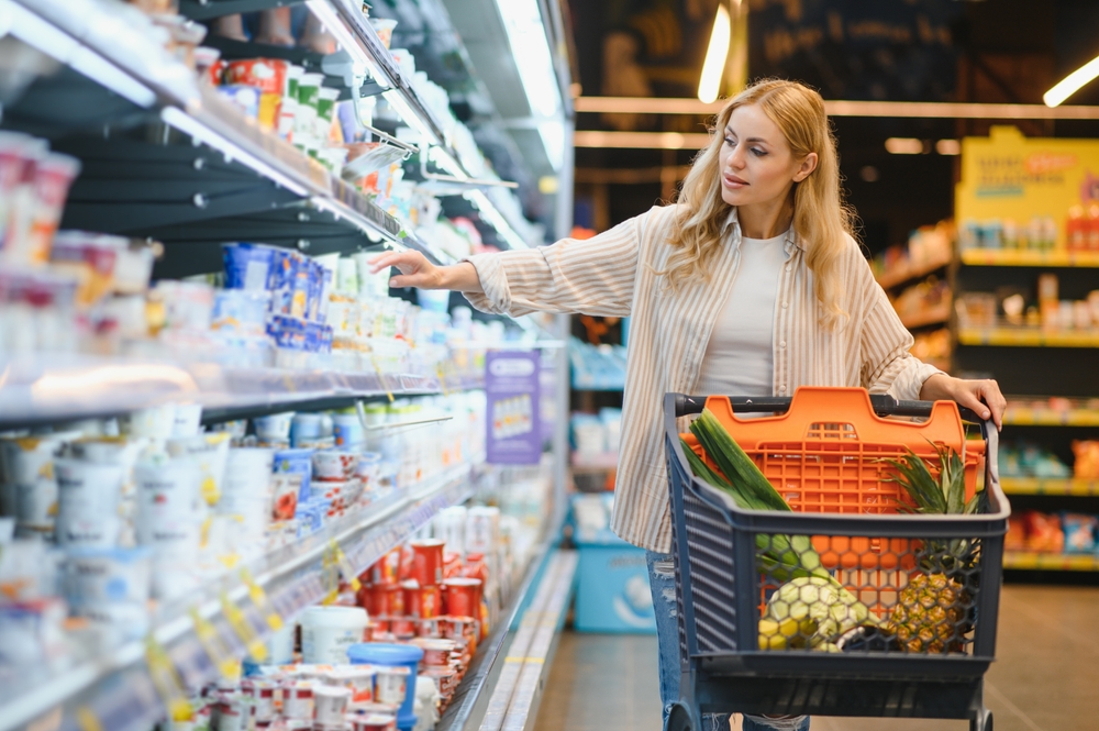 Person shopping for groceries with shopping cart at Dauphin Island grocery stores