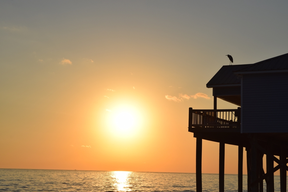 View of vacation rental on Dauphin Island at sunset